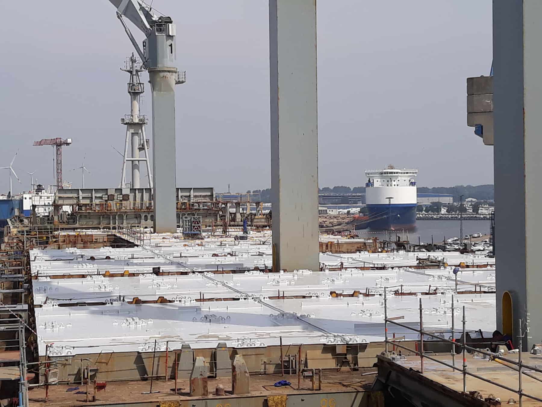 long range view of external hatch covers painted in white