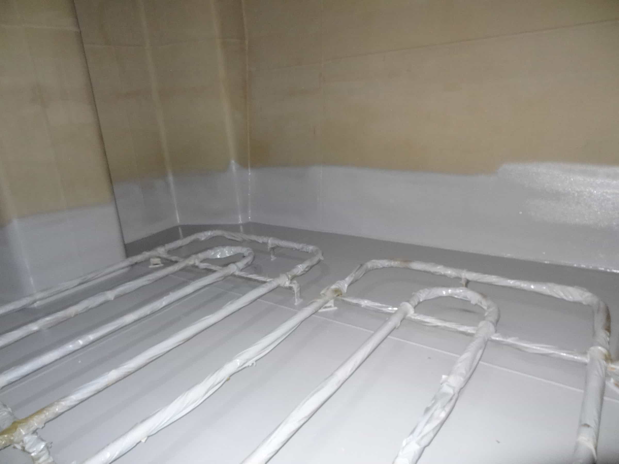 chemical tank floor, walls and piping painted grey