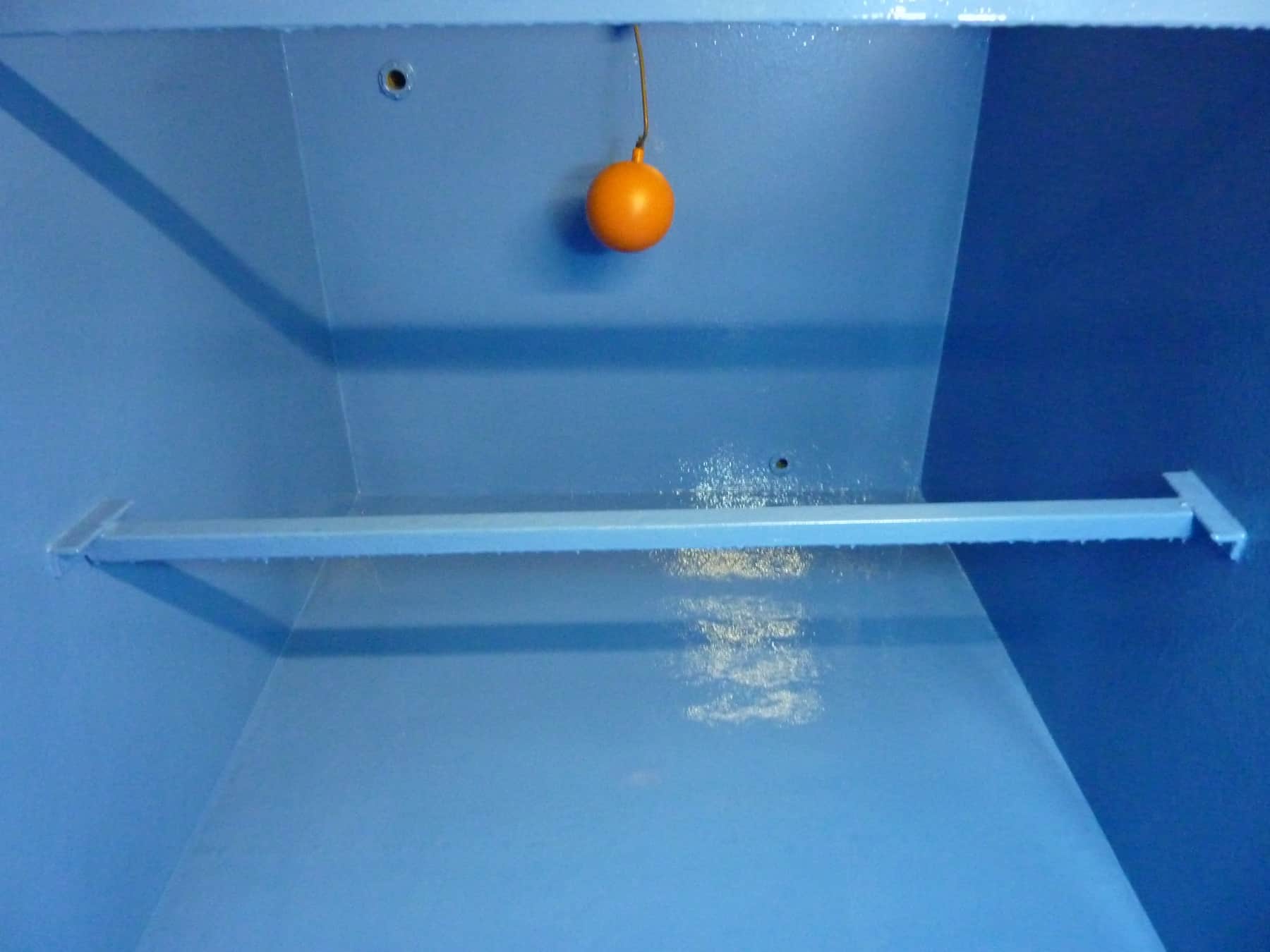 potable water tank internals painted in blue with orange ball gauge