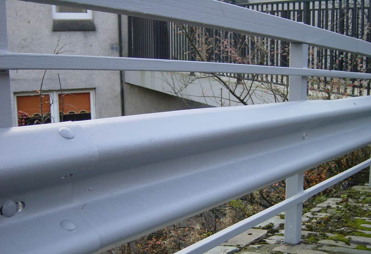 roadside safety barriers painted in grey