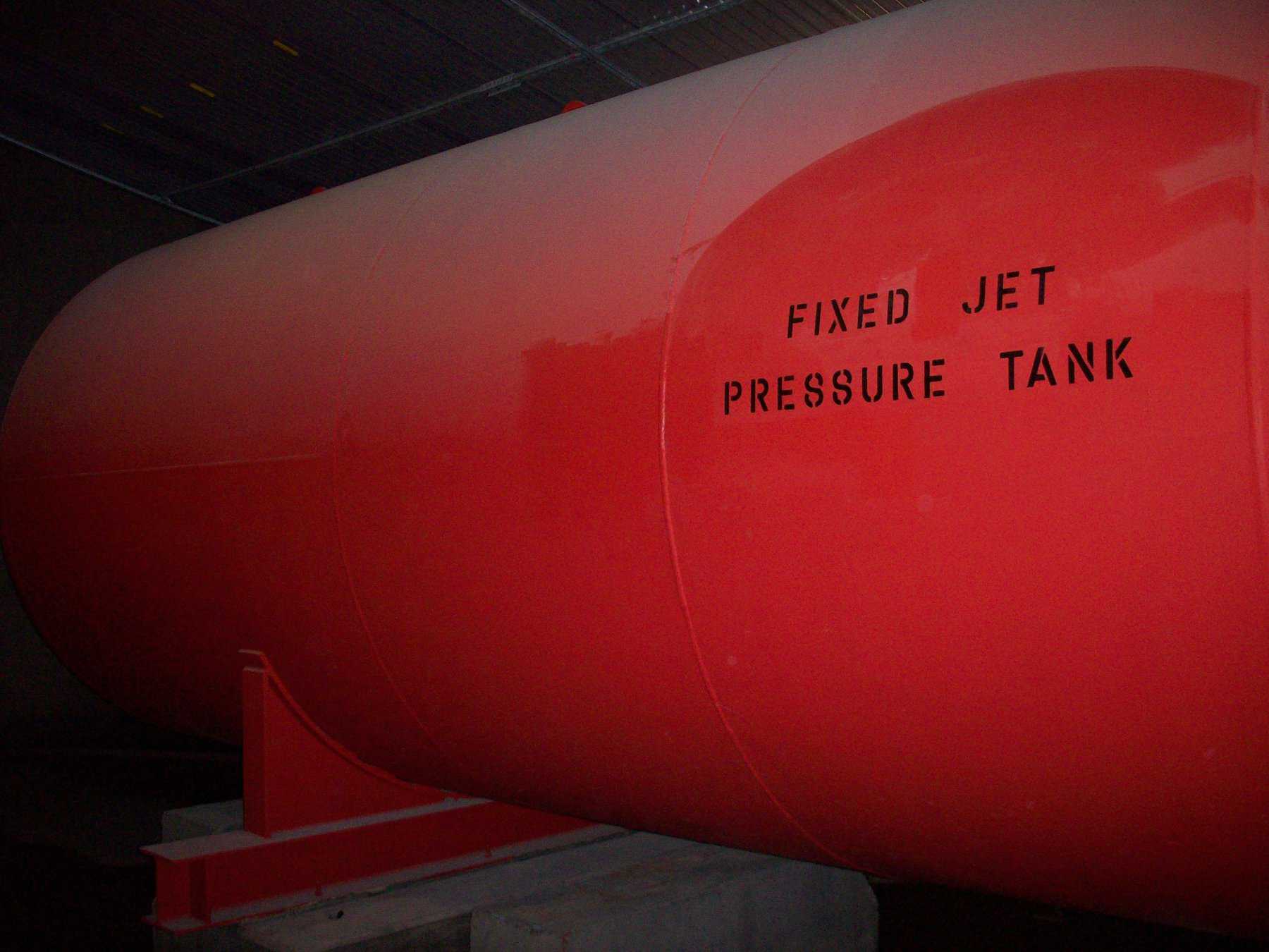 external cylinder tank painted in red with black text