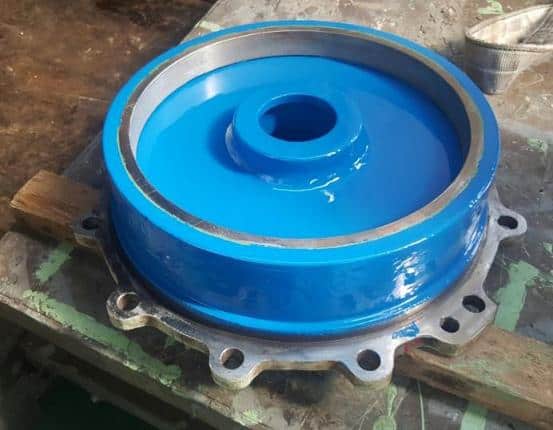 Completed Cold Pump Repair cold pump painted in blue sat on workbench