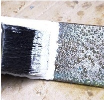 Application of RL 500PF brush application of white paint to sweating substrate