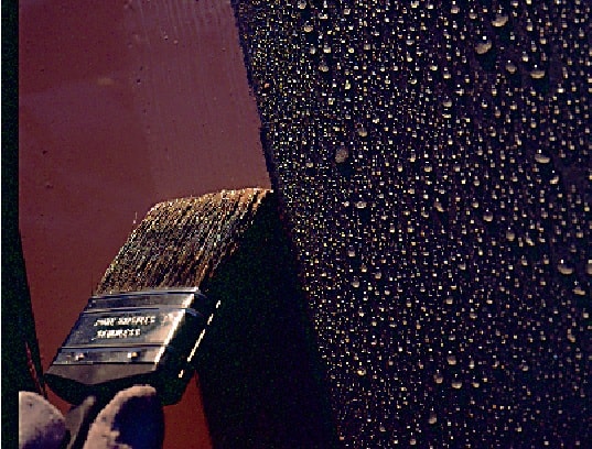 RS 500P – 4 brush application of maroon paint to sweating substrate