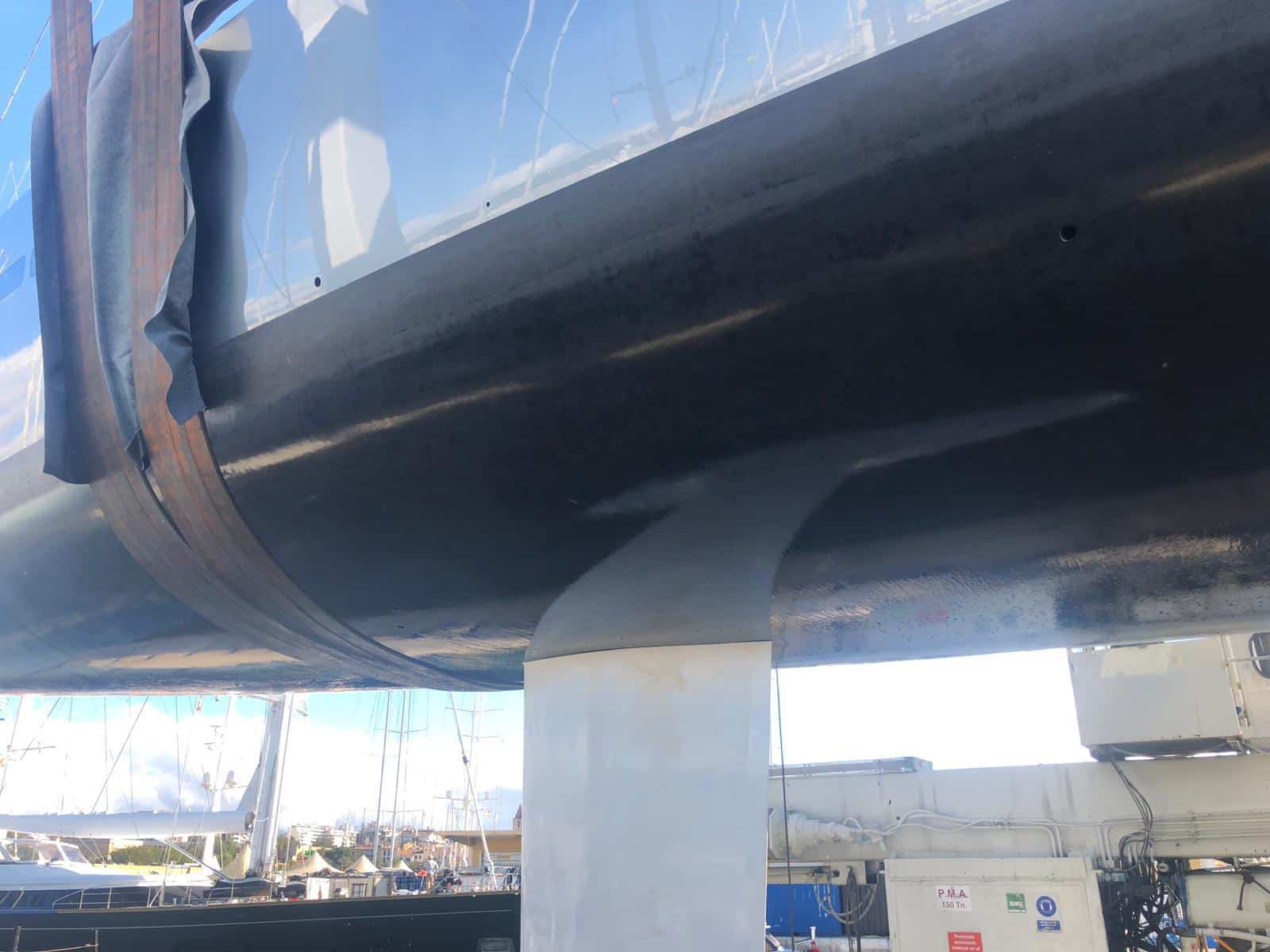 close up of yacht hull coated in black