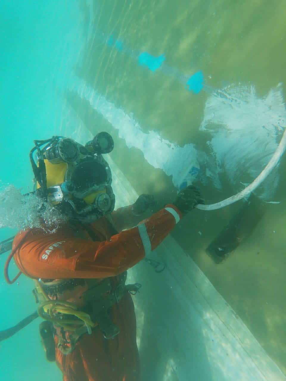 diver applying chemco coating to underwater substrate